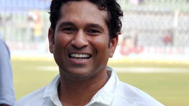 Sachin Tendulkar walks out to bat amidst loud cheers of fans and guard of honour by West Indies cricketers
